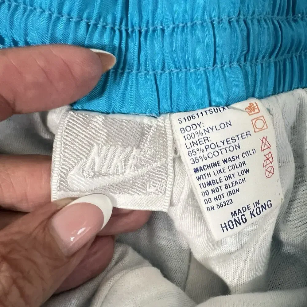 Vintage Nike Women’s Teal Nylon Windbreaker Track Pants Size L Lined 90’s